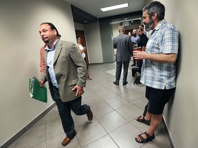 A meeting was held on Monday, July 20, 2015, by the city's compliance audit committee meeting looking into the complaint from Paul Synnott against Gabe Maggio. It's Windsor's first ever challenge of a candidate's expenses. Maggio (L) walks by Synnott after the meeting. (DAN JANISSE/The Windsor Star)