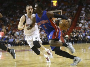 Detroit Pistons' Reggie Jackson (1) drives to the basket as Miami Heat's Beno Udrih defends during the first half of an NBA basketball game, Tuesday, Dec. 22, 2015, in Miami. (AP Photo/Lynne Sladky)