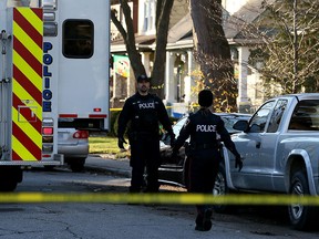 Windsor police officers at 187 Oak St. on Dec. 24, 2015 - the day after a fatal shooting at the address.