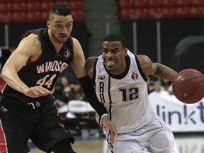 Halifax Rainmen's Cliff Clinkscales, right, clashes with Windsor Express's Ryan Anderson. (Windsor Star photo)