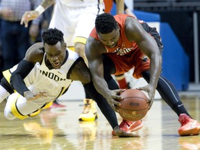 Windsor Express player Raheem Singleton recovers his fumbled ball before London Lightning player Tyshawn Patterson can reach it during their NBL Canada basketball game at Budweiser Gardens in London, Ont. on Tuesday December 29, 2015. Craig Glover/The London Free Press/Postmedia Network