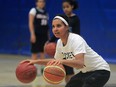 Miah-Marie Langlois, former guard with the OUA champion University of Windsor Lancers, demonstrates for about 45 basketball players during a skills camp at St. Denis Centre, December 28, 2015. (NICK BRANCACCIO/Windsor Star)