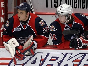 The Windsor Spitfires Brendan Johnston and Adam Bateman (right) watch from the bench as they take on the London Knights at the WFCU Centre in Windsor on Thursday, March 27, 2014.                        (TYLER BROWNBRIDGE/The Windsor Star)