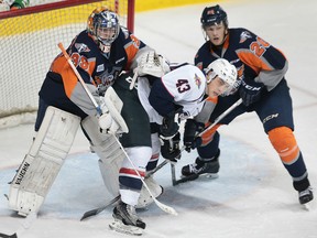 Daniel Beaudoin of Windsor creates havoc in front of goalie Alex Nedeljkovic and Josh Wesley of Flint during their game on Thursday, Dec. 3, 2015, at the WFCU Centre in Windsor.