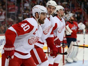 Henrik Zetterberg #40 of the Detroit Red Wings celebrates his first period goal with teammates against the Washington Capitals at Verizon Center on December 8, 2015 in Washington, DC. (Photo by Patrick Smith/Getty Images)