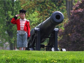 Amherstburg, May 16, 2015: Max D'Alfonso had been waiting for Fort Malden to open for two weeks and got his chance to dress in period attire and pose beside a cannon for his mother