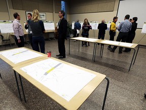Area residents get a look at proposals for the overpass that will lead to the customs and toll plaza of the Gordie Howe International Bridge at an open house at the Ojibway Nature Centre in Windsor on Tuesday, Dec. 15, 2015.
