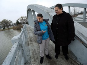 Sarah Rose Davis and her mother Rosemary Davis (right) return to the scene of their spectacular crash on the River Canard Bridge on Tuesday, Dec. 8, 2015.