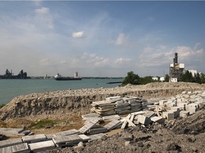 Rubble and concrete from the Parkway project is stored on land adjacent to Ojibway Shores Monday, August 25, 2014.  Some are concerned with the rubble deteriorating the Broadway drain where fish go to spawn.