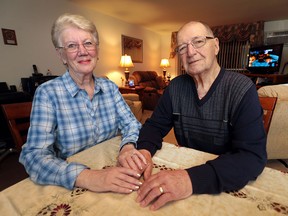 Terry and Maggie Crilley are shown in their apartment on Tuesday, Dec. 1, 2015 in Windsor, Ont. Maggie is the primary caregiver for her husband Terry who was diagnosed with Alzheimer's Disease five years ago.