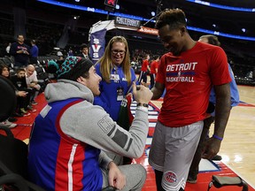 David Younan meets with the Detroit Pistons Brandon Jennings before their game against the Los Angeles Clippers at the Palace of Auburn Hills on Monday, December 14, 2015. Younan watched the team warm ups court side and had the chance to meet several players.
