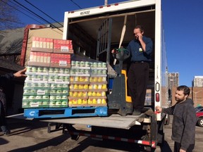Al Dickson, assistant store manager at the LaSalle Zerhs Markets, helps unload $12,000 worth of food and supplies at the Downtown Mission Friday Dec. 11, 2015.