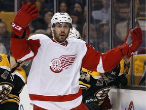 Detroit Red Wings' Drew Miller raises his arms as he looks for a penalty to be called against the Boston Bruins on Friday, April 18, 2014.