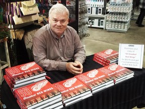 Windsor Star sports columnist Bob Duff with copies of his latest book - 50 Greatest Red Wings - at Cindy's in Kingville.