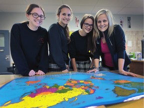 F.J. Brennan students, from left, Carly Jacobs, 15, Chloe Clement, 14, Lauren Pavelich, 15, and Corpus Christi School teacher Laurie Clement will be travelling to Ecuador over the Christmas holidays to help needy people in the country.