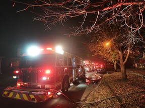 Fire crews are shown in the 3200 block of Edison Street in Windsor, Ont. on Friday, Dec. 4, 2015. An abandoned home suffered extensive damage