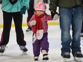 Addison Lagace-Vincent, 2, is shown at the New Year's Eve party at the Lanspeary Park outdoor skating rink on Thursday, Dec. 31, 2015, in Windsor, Ont.