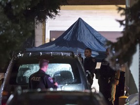 Windsor police work at the scene of a homicide at 187 Oak St., Wednesday, Dec. 23, 2015.