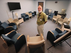 Thom Rolfe, executive director of the Hiatus House in Windsor, Ont., is shown in one of the group therapy rooms at the facility in this September 2015 file photo.