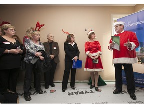 LEAMINGTON, ON.: DECEMBER 14, 2015 -- Hospice of Windsor executive director Carol Derbyshire, centre, Aline Levesque, playing the part of Mrs. Claus, and Tecumseh Mayor, Gary McNamara, speak to attendees at the nearly complete The Hospice Erie Shores Campus in Leamington, Monday, December 14, 2015.  (DAX MELMER/The Windsor Star)
