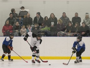 Family and friends watch a game between the Essex UCCU Blue #4 and the LaSalle Kings on Day 1 of the Hockey For Hospice 2015 at the Atlas Tube Centre, Sunday, Dec., 27, 2015.  The tournament involves 120 teams at four different arenas.