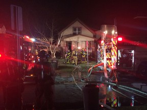 Windsor fire crews battle a house fire at 3666 Queen St. on Sunday, Dec. 20, 2015.
