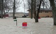 Flooding caused by high winds and waves from Lake Erie is seen on Lakeshore Drive near Fox Run Road in Leamington in December 2015.
