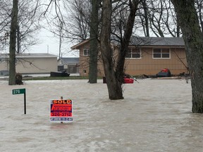 Flooding caused by high winds and waves from Lake Erie is seen on Lakeshore Drive near Fox Run Road in Leamington in December 2015.