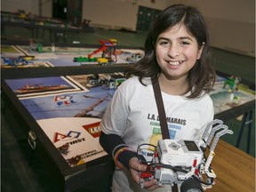 Leena Shaya, 11, a Grade 7 student at L.A. Desmarais Catholic Elementary School, is pictured with her team's Lego robot at the Windsor F.I.R.S.T Lego League at St. Clair College, Sunday, December 6, 2015.