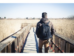 Man walking with backpack. Photo by fotolia.com.