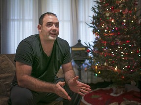 Dan Petoran, a resident of Oak Street, discusses spending Christmas in the middle of a crime scene, Saturday, Dec. 26, 2015. A man was murdered in the yard next to Petoran's home on Wednesday, Dec. 23, 2015.