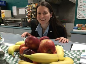 Heather Nadon, a registered dietitian with the Windsor-Essex County Health Unit, eyes some fruit at the Tecumseh arena concession stand on Tuesday, Dec. 15, 2015. The fruit is part of a new healthy eating program called Take Charge which is being tried in Tecumseh and LaSalle.