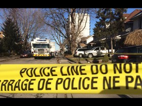Police tape lines the crime scene at 187 Oak St. on Dec. 24, 2015 - the day after a fatal shooting at the address.