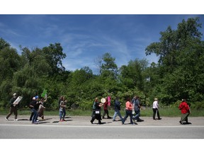 In this file photo, demonstrators march up and down Matchette Road in front of the Ojibway Nature Centre protesting plans to build big box stores close to Ojibway Park, Saturday, May 25, 2013.  (DAX MELMER/The Windsor Star)