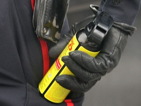 A Windsor police officer holds a can of pepper spray in this file photo.