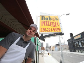 Bob Ristovski, owner of Bob O's Pizza on Pelissier Street in Windsor, Ont., is pictured on Dec. 18, 2015. A Windsor church congregation pooled their resources to deliver the massive gift to a pizza delivery driver from a pizza company whose name was pulled from a hat.