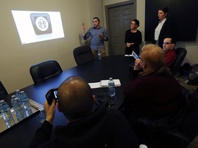 Bakir Merachli, Carly Hogan and Cait Mailloux (left to right) present their advertising proposal to Pushers Collective in Windsor on Tuesday, Dec. 8, 2015. Advertising students made pitches to downtown businesses.