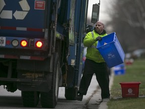 Recycling is picked up on Longfellow Avenue in Windsor on Wednesday, Dec. 16, 2015.