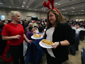 Volunteers serve up Christmas dinner at the annual Salvation Army Christmas Dinner at the St. Clair Centre for the Arts in Windsor on Wednesday, Dec. 16, 2015. Hundreds turned out for the annual dinner.