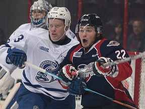 Stefan LeBlanc (L) of Mississauga and Brendan Lemieux of Windsor battle in front of the net during their game at the WFCU Centre on Thursday, Dec. 10, 2015 in Windsor, Ont.