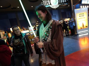 Lauren Hedges and Emmanuel Gambriel pick up their tickets for the opening night of the New Star Wars movie at Silver City in Windsor on Thursday, Dec. 17, 2015. Tickets for the first show sold out over three weeks ago. Star Wars The Force Awakens is the latest in the series that started in 1977.