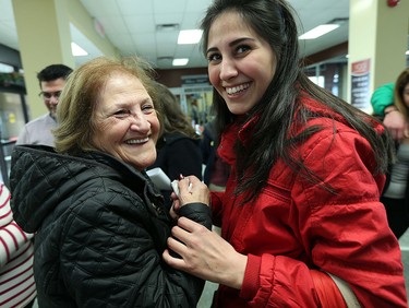 Rawan Farah is greeted by her grandmother Salam Ashkar (left) after arriving in Windsor on Friday, Dec. 11, 2015. The Syrian family arrived from Lebanon after a stop over in Toronto.