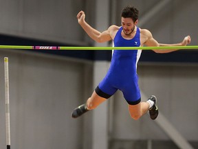 Milos Savic competes in the pole vault event during the annual Blue and Gold track meet on Monday, December 7, 2015, at the University of Windsor.