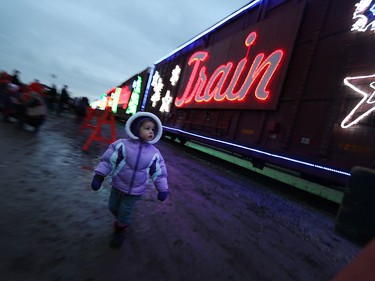 Brandii Rioux takes in the signs at the CP Holiday Train at the CP rail yard in Windsor on Wednesday, Dec. 2, 2015.