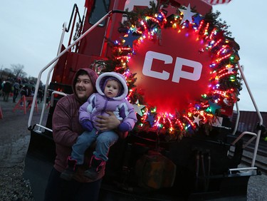 Brandii Rioux and her dad Darryl Rioux pose for a picture at the CP Holiday Train at the CP rail yard in Windsor on Wednesday, Dec. 2, 2015.