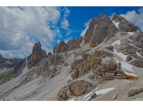 Rifugio Passo Principe, at right, clings to a steep rocky ledge in the Dolomites. (Postmedia Network files)