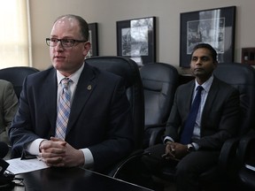 Mayor Drew Dilkens, left, and Rakesh Naidu, interim CEO address a $2.3 million surplus on the WindsorEssex Economic Development Corporation books during a press conference at city hall in Windsor on Wednesday, December 2, 2015. The WindsorEssex Economic Development Corporation will return $1.7 million dollars to the city and the county after occurring the surplus over several years. The corporation will retain a $600,000 contingency fund.