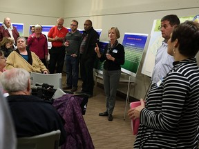 Jan Wilson, centre, leads an open house on the future of the Atkinson Pool at Adie Knox Community Centre in Windsor on Tuesday, Dec. 15, 2015.