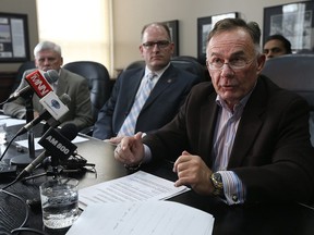 Peter Roth, Mayor Drew Dilkens, Marty Komsa and Rakesh Naidu, interm CEO, (left to right) of the WindsorEssex Economic Development Corporation, are pictured during a press conference at city hall in Windsor on Wednesday, Dec. 2, 2015.