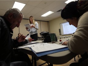 English teacher Elma Catic leads a group of new Canadians during an english class at the YMCA in Windsor on Monday, Nov. 30, 2015.